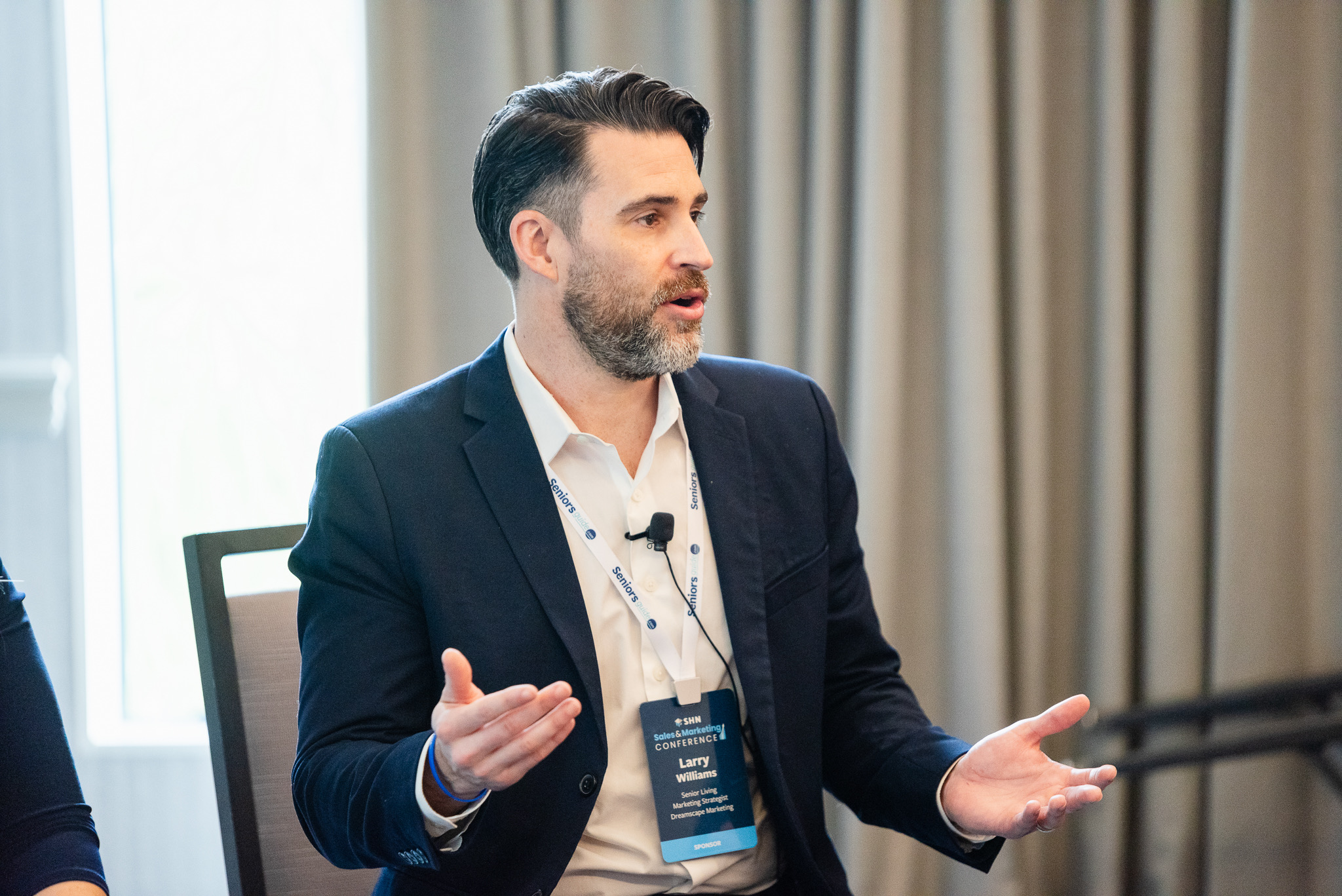 Larry Williams speaking at an industry conference